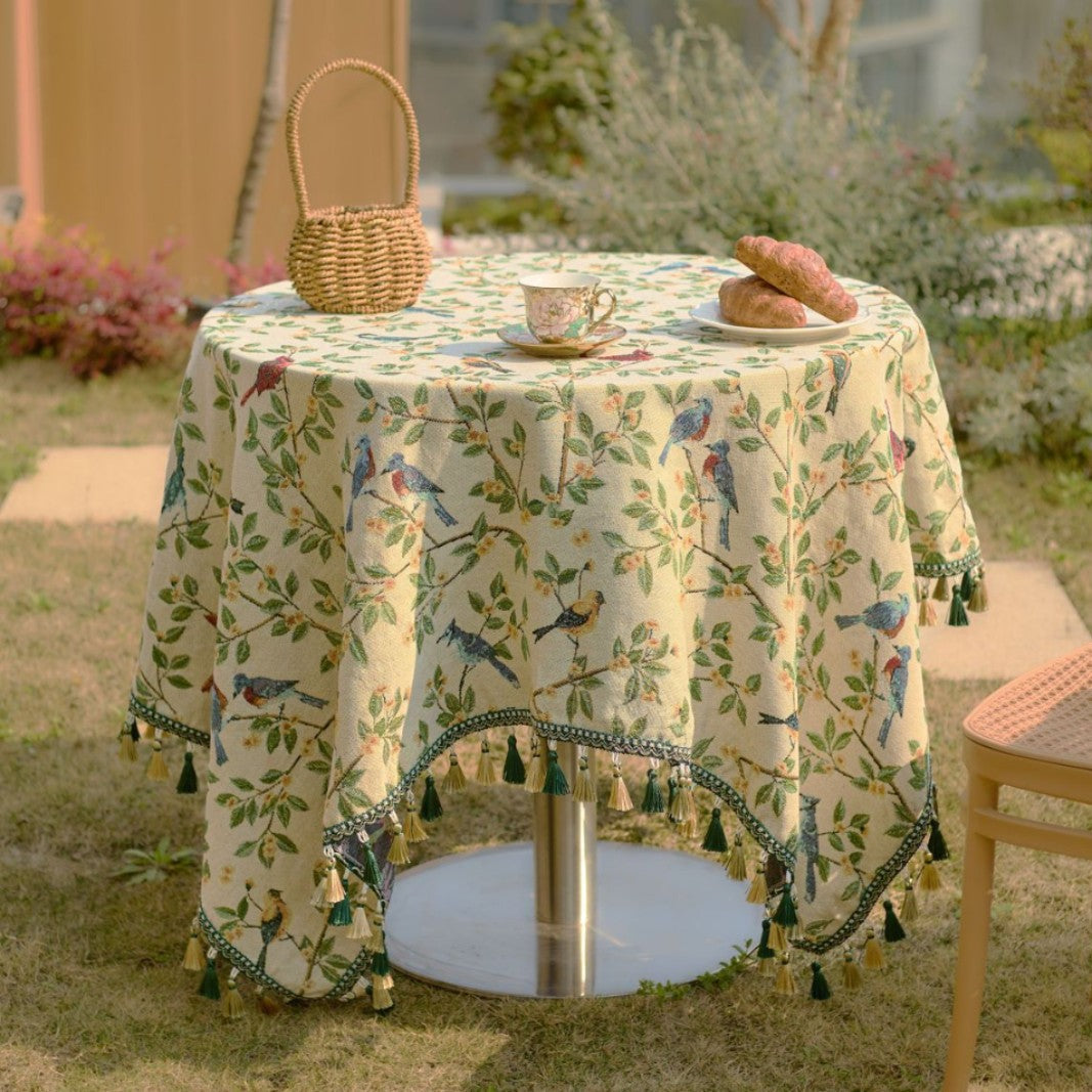 Green floral jacquard tablecloth on vintage dining table