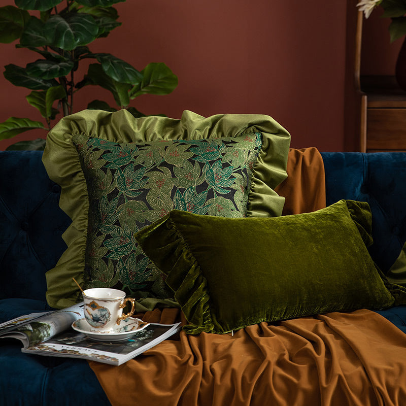 Elegant vintage green leaf cushions and velvet pillow set in cozy living room