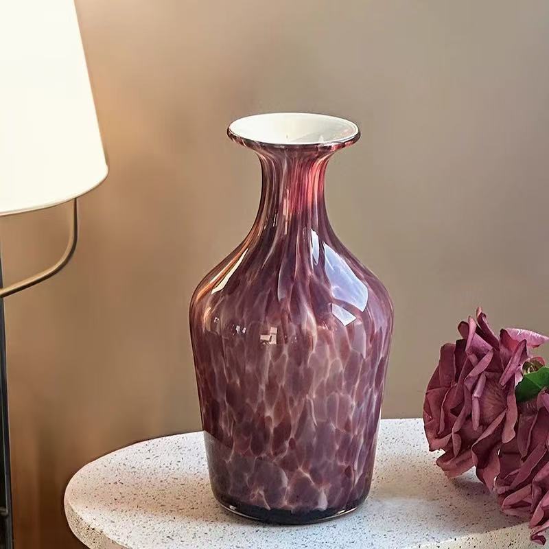 Vintage purple glass vase decorative piece in modern living room