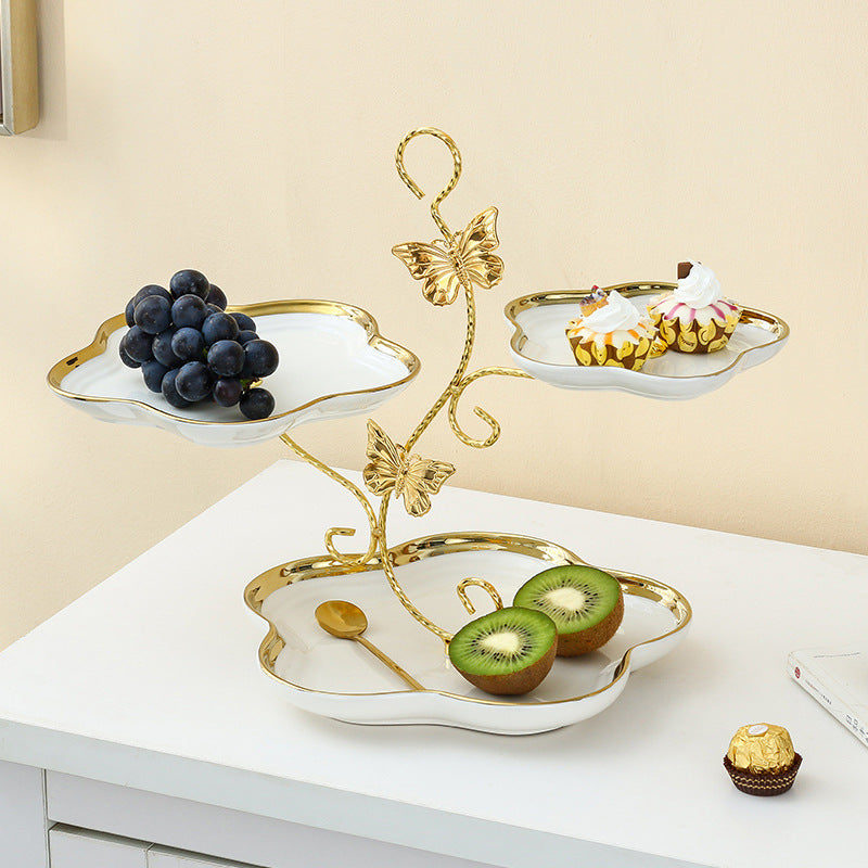 Stylish white ceramic three-layer serving tray for afternoon tea and fruits